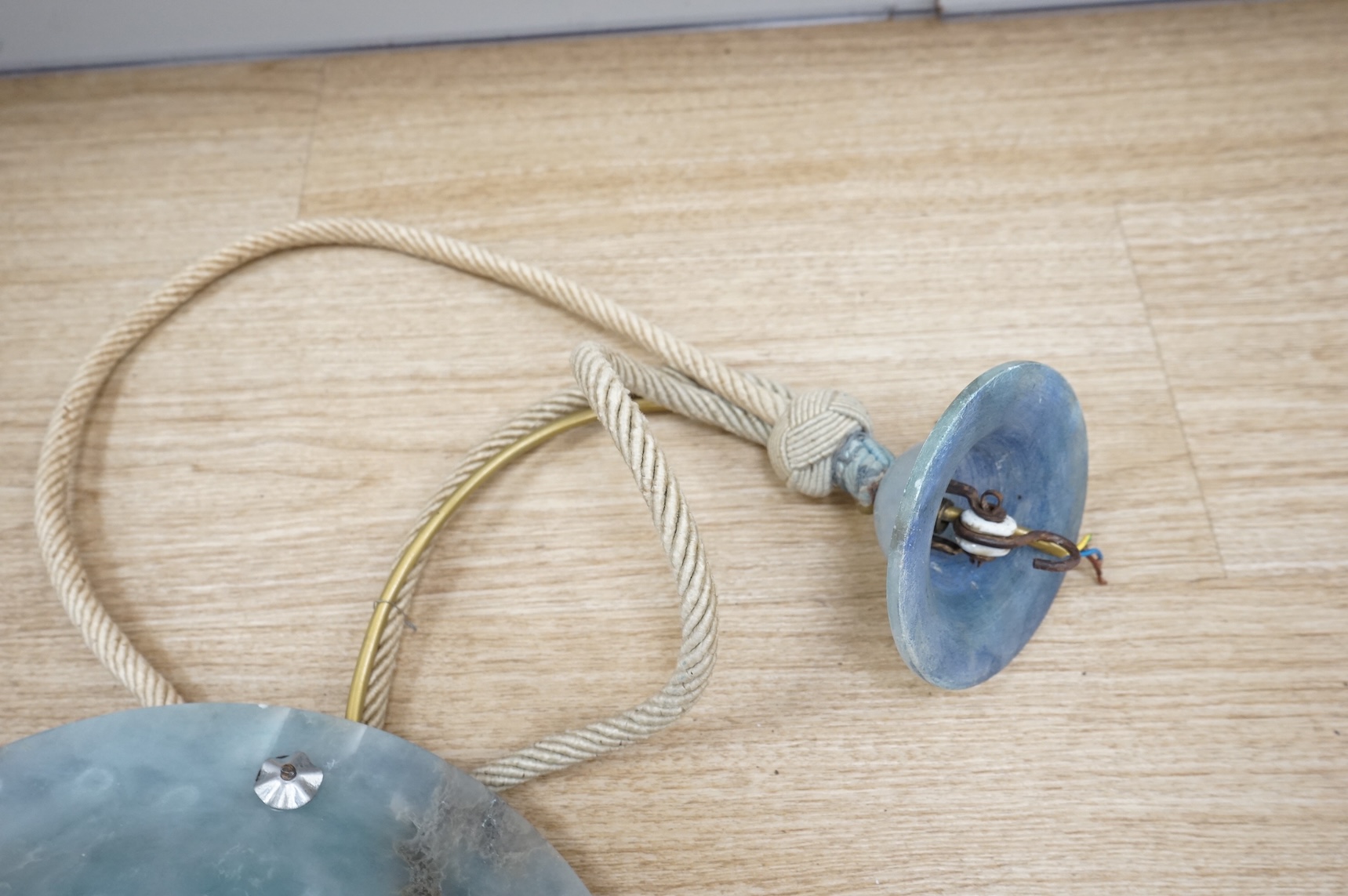 A French Art Deco blue alabaster plafonnier and matching ceiling rose, with cream cord, inscribed number, 30cm diameter
